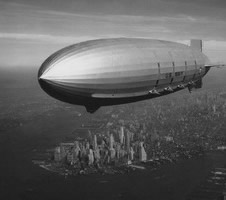 The USS Macon flies over New York. The rigid airship first flew for the US Navy in 1933 and crashed in 1935